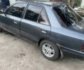 Серый Мазда 323, объемом двигателя 1.6 л и пробегом 250 тыс. км за 711 $, фото 1 на Automoto.ua