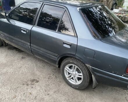 Серый Мазда 323, объемом двигателя 1.6 л и пробегом 150 тыс. км за 1500 $, фото 1 на Automoto.ua