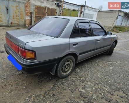 Серый Мазда 323, объемом двигателя 1.3 л и пробегом 130 тыс. км за 2500 $, фото 1 на Automoto.ua