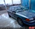 Серый Мазда 323, объемом двигателя 1.5 л и пробегом 318 тыс. км за 1100 $, фото 1 на Automoto.ua