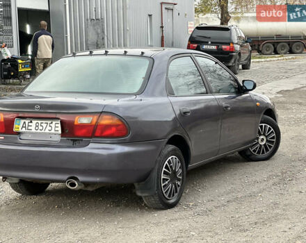 Серый Мазда 323, объемом двигателя 1.5 л и пробегом 320 тыс. км за 1700 $, фото 2 на Automoto.ua