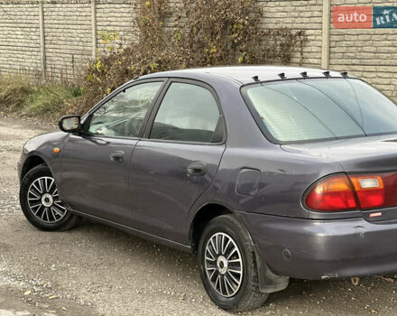 Серый Мазда 323, объемом двигателя 1.5 л и пробегом 320 тыс. км за 1700 $, фото 5 на Automoto.ua