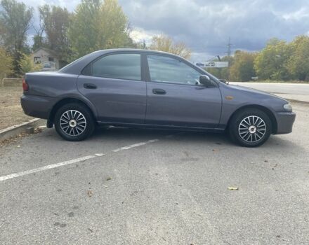 Серый Мазда 323, объемом двигателя 1.5 л и пробегом 370 тыс. км за 1699 $, фото 7 на Automoto.ua