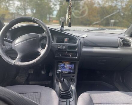 Серый Мазда 323, объемом двигателя 1.5 л и пробегом 370 тыс. км за 1699 $, фото 12 на Automoto.ua