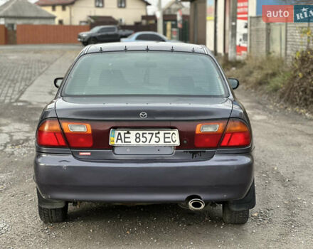 Серый Мазда 323, объемом двигателя 1.5 л и пробегом 320 тыс. км за 1700 $, фото 1 на Automoto.ua