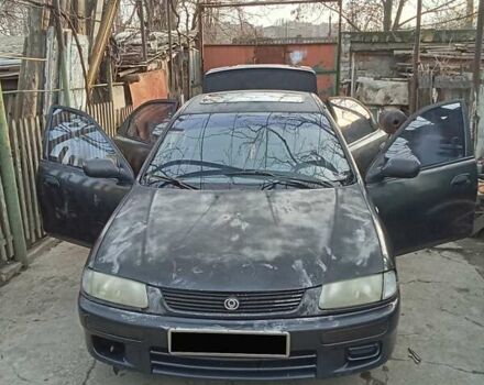 Серый Мазда 323, объемом двигателя 1.5 л и пробегом 500 тыс. км за 2000 $, фото 5 на Automoto.ua