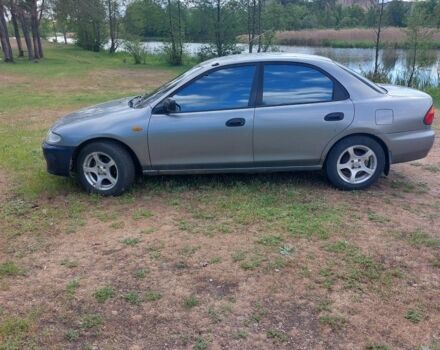 Сірий Мазда 323, об'ємом двигуна 1.5 л та пробігом 294 тис. км за 2000 $, фото 3 на Automoto.ua