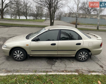 Серый Мазда 323, объемом двигателя 1.5 л и пробегом 286 тыс. км за 2450 $, фото 1 на Automoto.ua