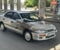 Серый Мазда 323, объемом двигателя 1.49 л и пробегом 300 тыс. км за 750 $, фото 1 на Automoto.ua