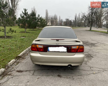 Серый Мазда 323, объемом двигателя 1.5 л и пробегом 286 тыс. км за 2450 $, фото 3 на Automoto.ua