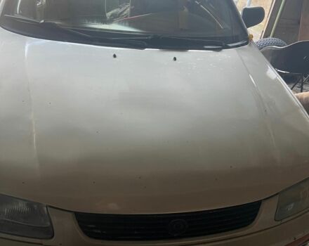 Серый Мазда 323, объемом двигателя 1.49 л и пробегом 310 тыс. км за 1000 $, фото 1 на Automoto.ua