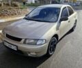 Серый Мазда 323, объемом двигателя 2 л и пробегом 234 тыс. км за 1350 $, фото 1 на Automoto.ua