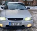 Серый Мазда 323, объемом двигателя 1.49 л и пробегом 250 тыс. км за 1900 $, фото 1 на Automoto.ua