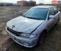 Серый Мазда 323, объемом двигателя 1.5 л и пробегом 250 тыс. км за 900 $, фото 1 на Automoto.ua