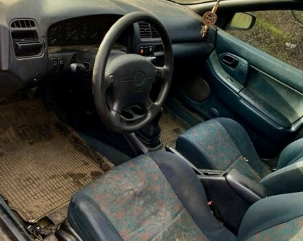 Сірий Мазда 323, об'ємом двигуна 1.5 л та пробігом 300 тис. км за 1200 $, фото 1 на Automoto.ua