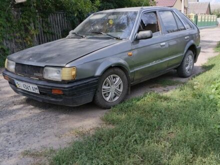 Серый Мазда 323, объемом двигателя 0 л и пробегом 350 тыс. км за 605 $, фото 1 на Automoto.ua