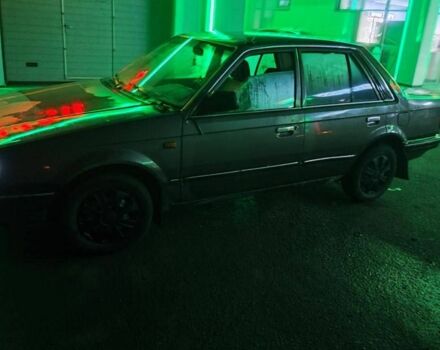 Серый Мазда 323, объемом двигателя 1.3 л и пробегом 200 тыс. км за 821 $, фото 1 на Automoto.ua