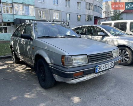 Серый Мазда 323, объемом двигателя 1.32 л и пробегом 255 тыс. км за 900 $, фото 1 на Automoto.ua