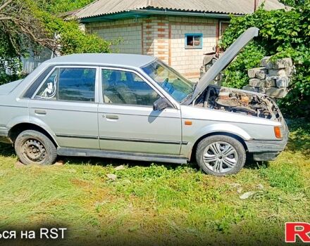 Серый Мазда 323, объемом двигателя 1.3 л и пробегом 230 тыс. км за 680 $, фото 1 на Automoto.ua