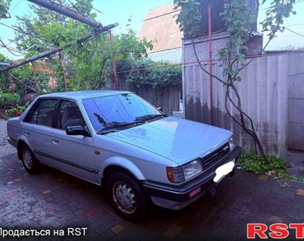 Серый Мазда 323, объемом двигателя 1.3 л и пробегом 92 тыс. км за 1300 $, фото 1 на Automoto.ua