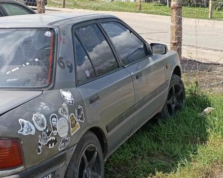 Сірий Мазда 323, об'ємом двигуна 1.5 л та пробігом 1 тис. км за 448 $, фото 1 на Automoto.ua
