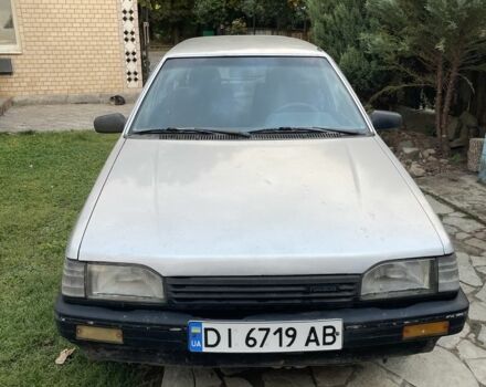 Серый Мазда 323, объемом двигателя 1.5 л и пробегом 85 тыс. км за 302 $, фото 1 на Automoto.ua