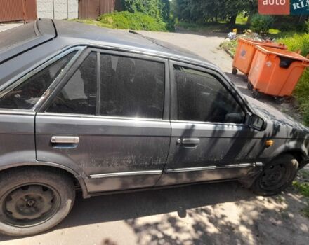 Серый Мазда 323, объемом двигателя 1.5 л и пробегом 150 тыс. км за 358 $, фото 1 на Automoto.ua