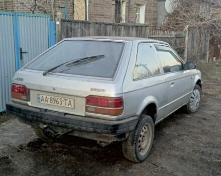 Серый Мазда 323, объемом двигателя 1.5 л и пробегом 500 тыс. км за 569 $, фото 1 на Automoto.ua