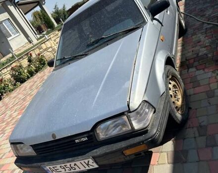 Серый Мазда 323, объемом двигателя 1.3 л и пробегом 300 тыс. км за 826 $, фото 1 на Automoto.ua