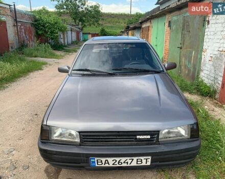 Серый Мазда 323, объемом двигателя 1.3 л и пробегом 203 тыс. км за 700 $, фото 1 на Automoto.ua