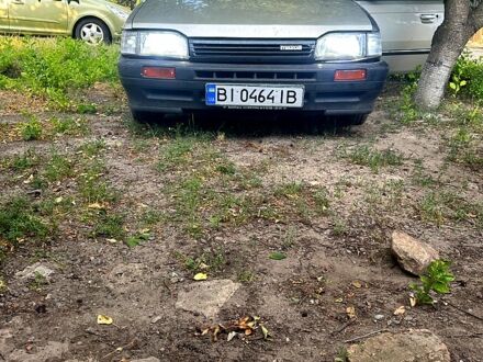 Серый Мазда 323, объемом двигателя 1.3 л и пробегом 167 тыс. км за 530 $, фото 1 на Automoto.ua