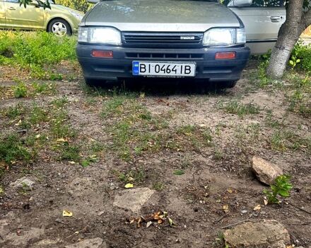 Сірий Мазда 323, об'ємом двигуна 1.3 л та пробігом 167 тис. км за 530 $, фото 1 на Automoto.ua