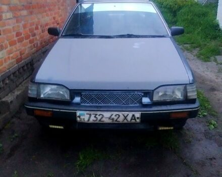 Серый Мазда 323, объемом двигателя 1.5 л и пробегом 320 тыс. км за 399 $, фото 1 на Automoto.ua