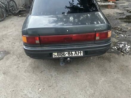 Серый Мазда 323, объемом двигателя 1.6 л и пробегом 250 тыс. км за 711 $, фото 1 на Automoto.ua