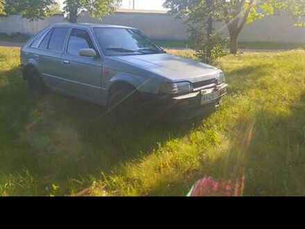 Сірий Мазда 323, об'ємом двигуна 1.3 л та пробігом 222 тис. км за 200 $, фото 1 на Automoto.ua