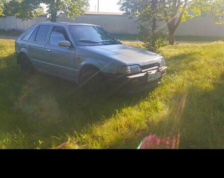 Серый Мазда 323, объемом двигателя 1.3 л и пробегом 222 тыс. км за 200 $, фото 1 на Automoto.ua