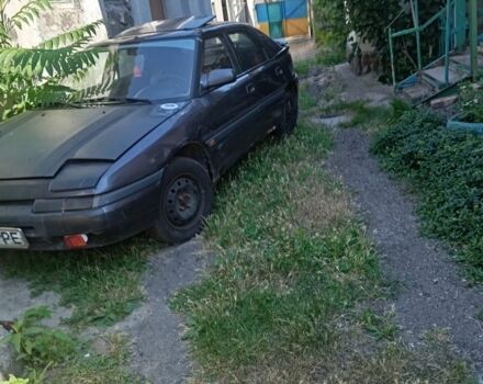 Серый Мазда 323, объемом двигателя 0 л и пробегом 320 тыс. км за 798 $, фото 1 на Automoto.ua