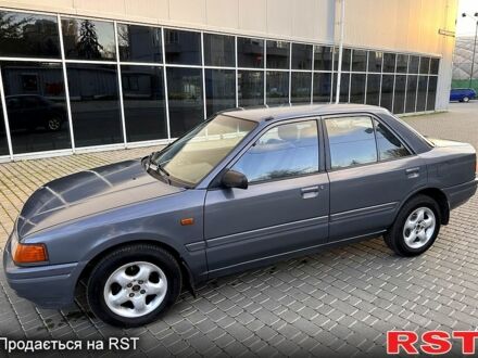 Серый Мазда 323, объемом двигателя 1.7 л и пробегом 220 тыс. км за 1350 $, фото 1 на Automoto.ua