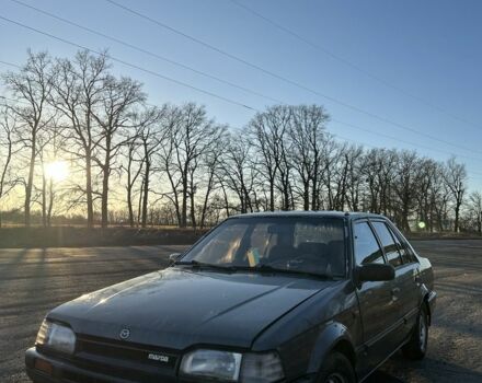 Серый Мазда 323, объемом двигателя 1.4 л и пробегом 111 тыс. км за 950 $, фото 1 на Automoto.ua