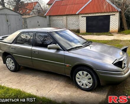 Серый Мазда 323, объемом двигателя 1.6 л и пробегом 220 тыс. км за 1100 $, фото 1 на Automoto.ua
