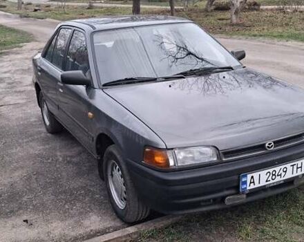 Серый Мазда 323, объемом двигателя 1 л и пробегом 420 тыс. км за 2700 $, фото 1 на Automoto.ua