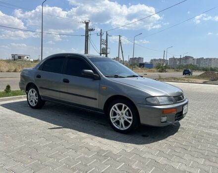 Сірий Мазда 323, об'ємом двигуна 1.5 л та пробігом 232 тис. км за 2607 $, фото 1 на Automoto.ua