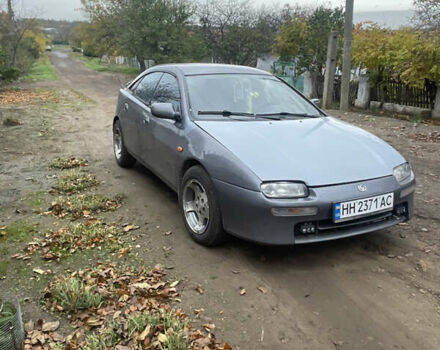 Серый Мазда 323, объемом двигателя 2 л и пробегом 280 тыс. км за 2250 $, фото 1 на Automoto.ua