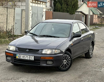 Серый Мазда 323, объемом двигателя 1.5 л и пробегом 320 тыс. км за 1700 $, фото 1 на Automoto.ua