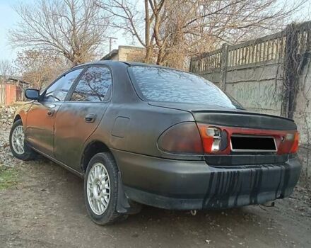 Серый Мазда 323, объемом двигателя 1.5 л и пробегом 500 тыс. км за 2000 $, фото 1 на Automoto.ua