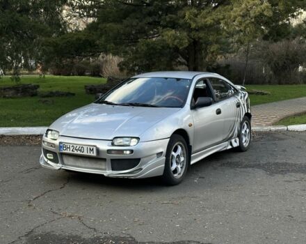 Серый Мазда 323, объемом двигателя 1.5 л и пробегом 200 тыс. км за 1400 $, фото 1 на Automoto.ua