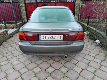 Серый Мазда 323, объемом двигателя 1.5 л и пробегом 200 тыс. км за 800 $, фото 1 на Automoto.ua