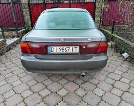 Серый Мазда 323, объемом двигателя 1.5 л и пробегом 200 тыс. км за 800 $, фото 1 на Automoto.ua