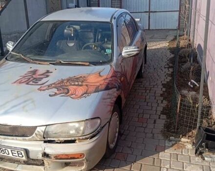 Серый Мазда 323, объемом двигателя 1.5 л и пробегом 419 тыс. км за 1100 $, фото 1 на Automoto.ua