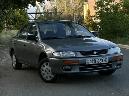 Сірий Мазда 323, об'ємом двигуна 1.5 л та пробігом 201 тис. км за 2100 $, фото 1 на Automoto.ua